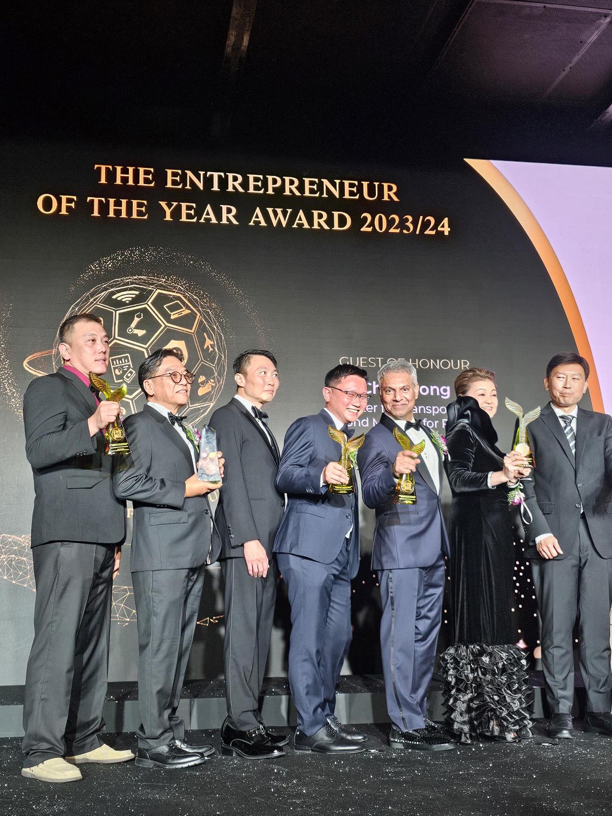 Frank Chen (4th from left) on stage with the other winners after receiving his trophy
