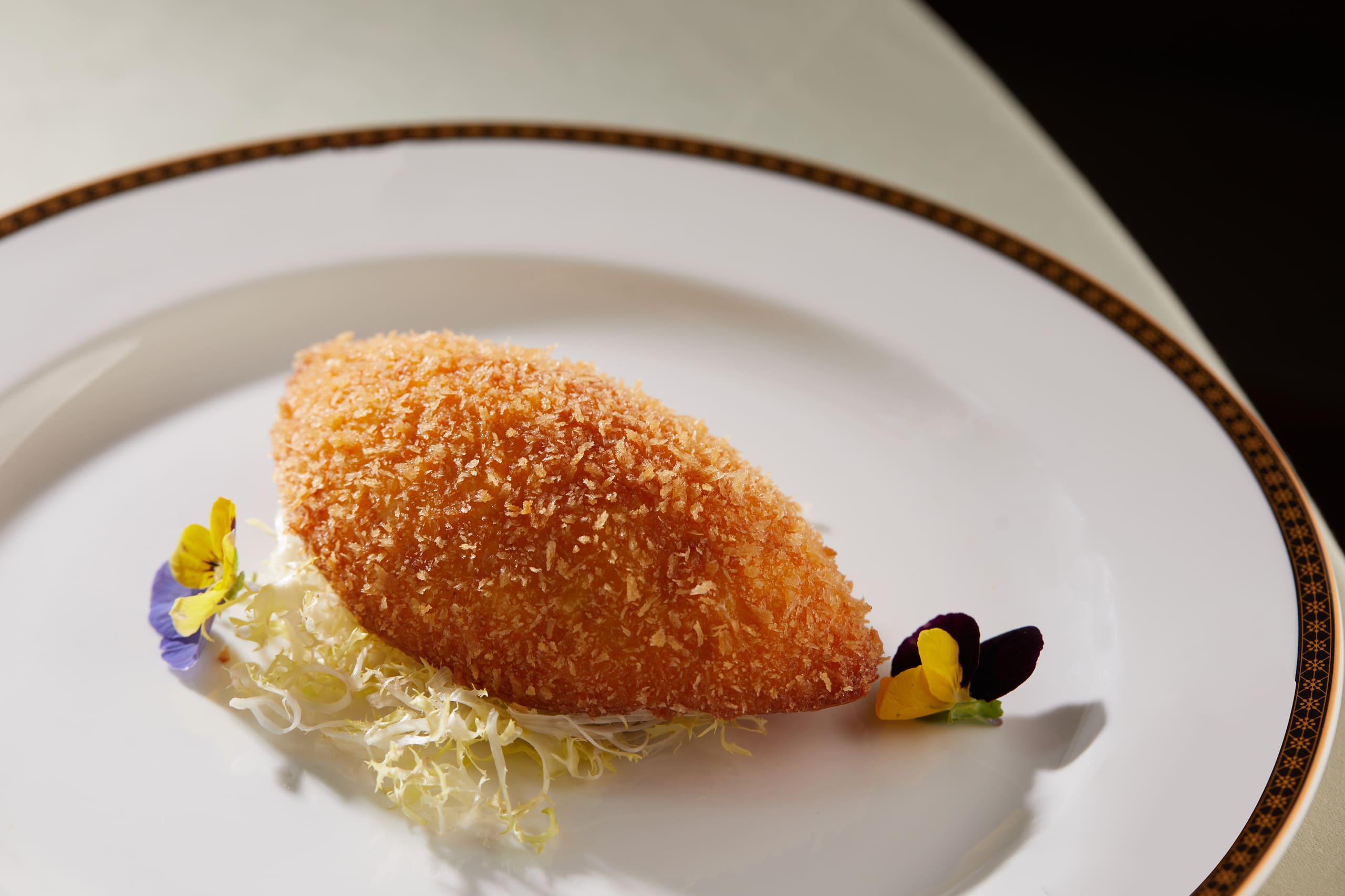 Deep-fried crab meat and onion in crab shell
