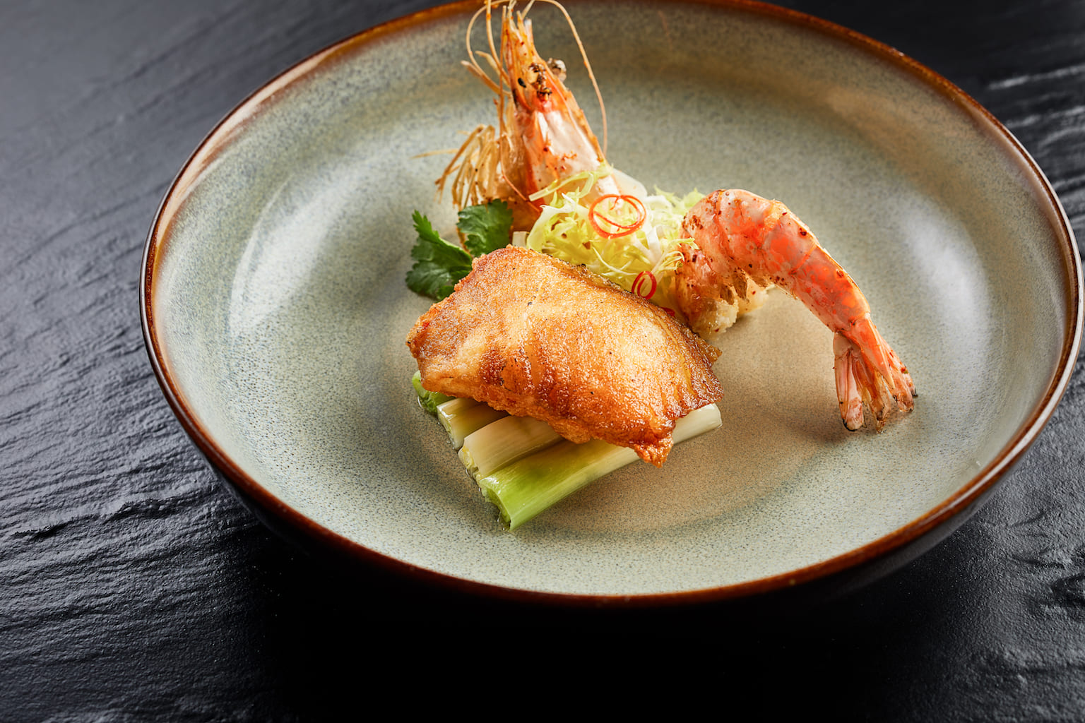 Fried cod fish fillet accompanied with king prawn