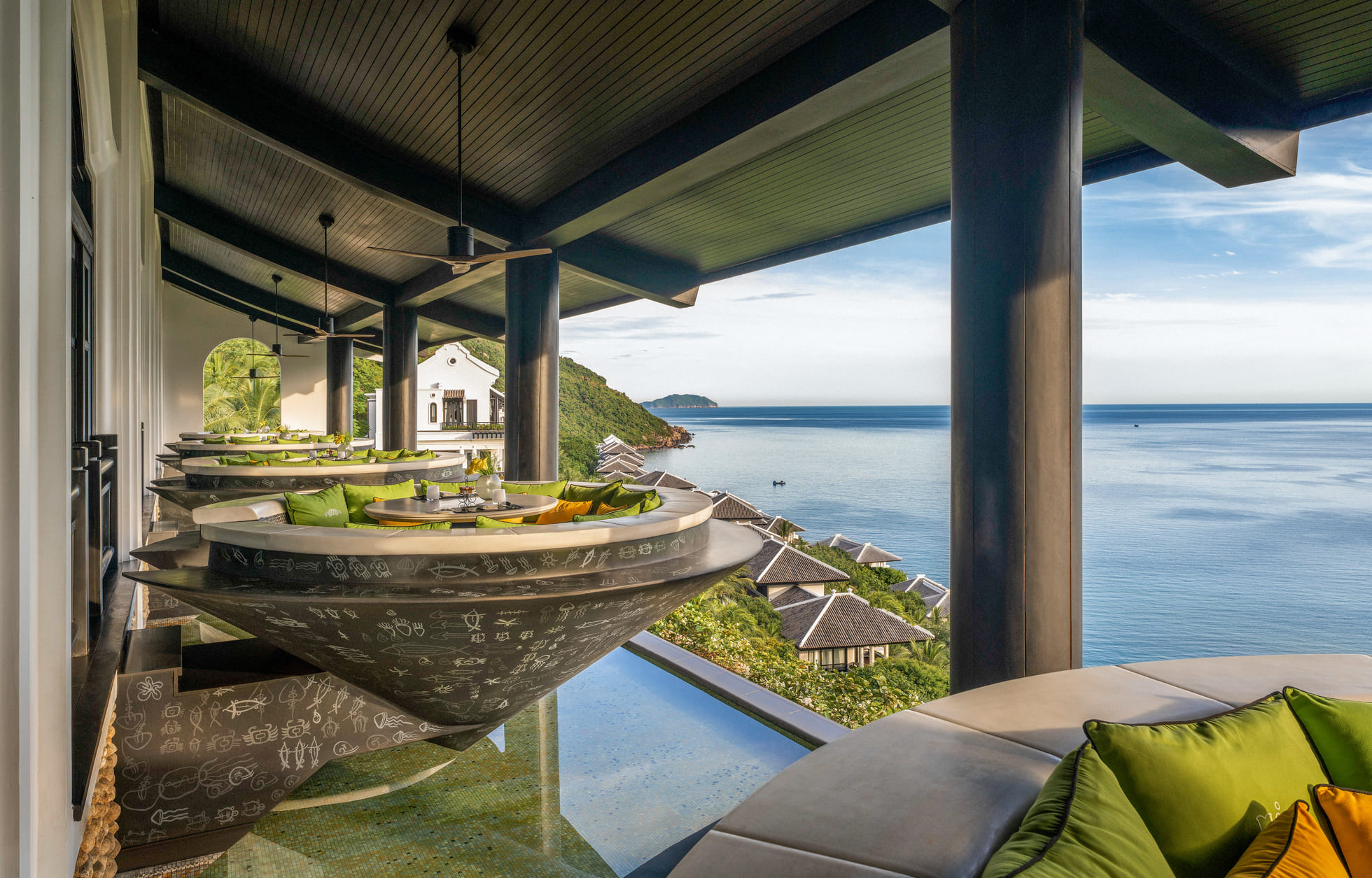 At Citron, guests can dine in unique circular seats shaped like Vietnam's iconic non-la hats, overlooking the ocean